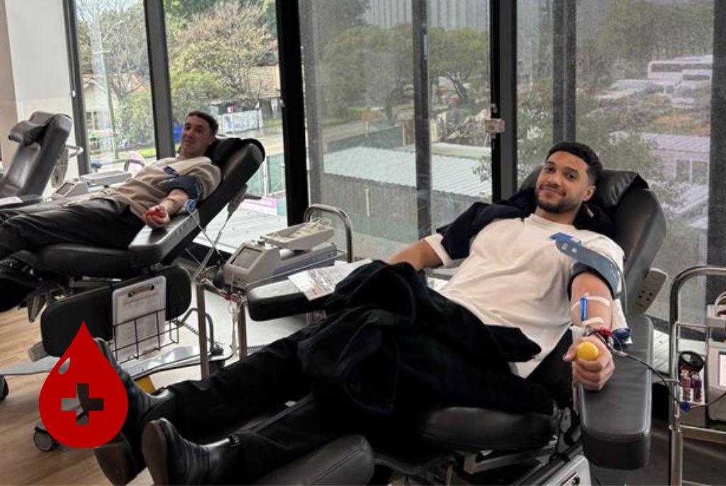 Ritchie and Liam giving blood