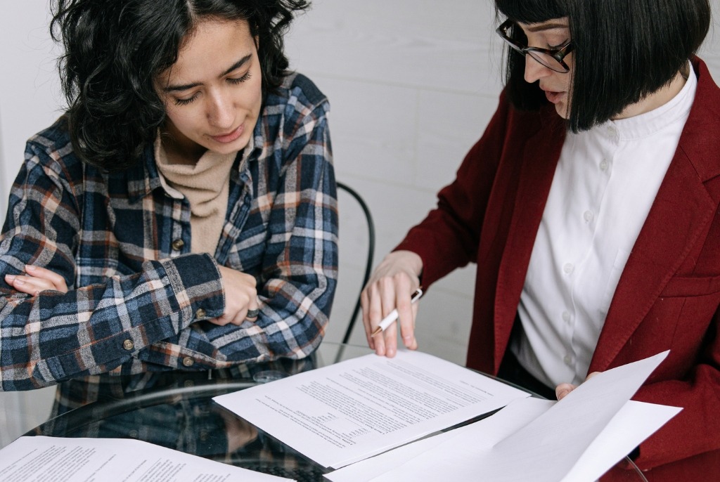 Business owner reviewing loan documents with a financial adviser during a business loan review in Australia